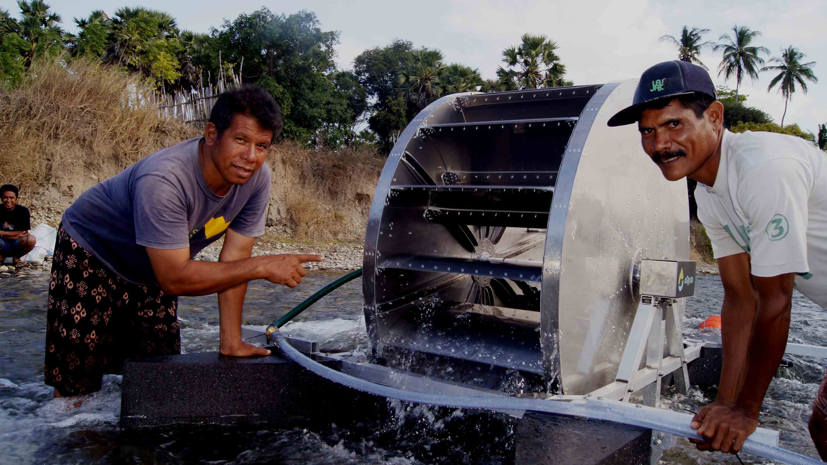 People and turbine in the river