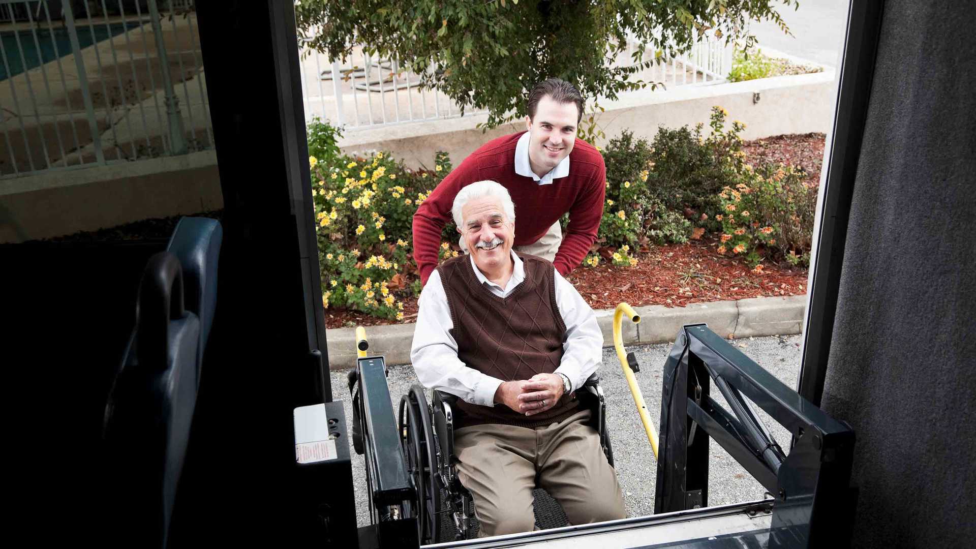 Son assisting dad on a wheelchair